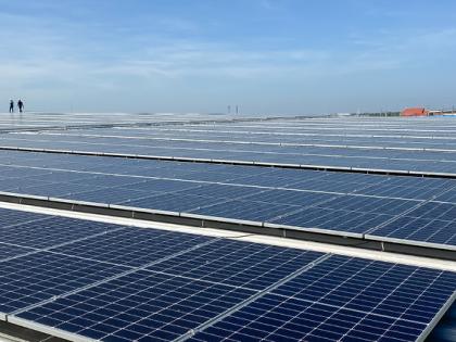 Construction workers standing on solar panels