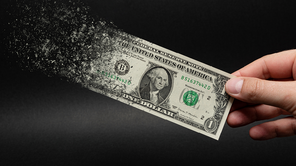 Dollar bill turning to dust