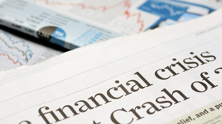 Newspapers with headlines about a financial crises
