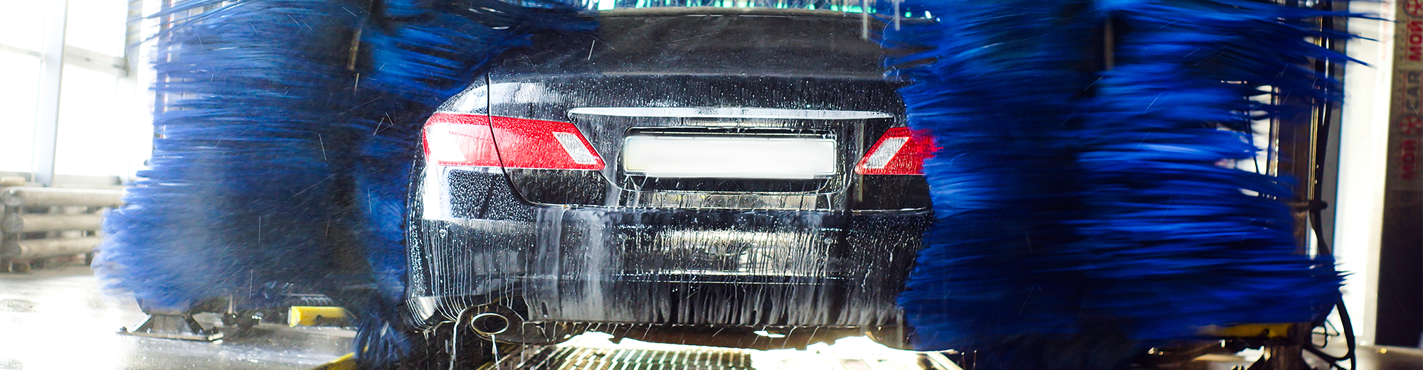 A black car going through a car wash