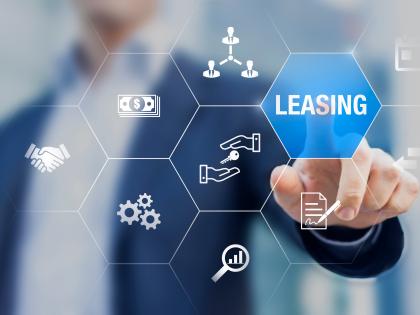 Image of man pointing to word "leasing"