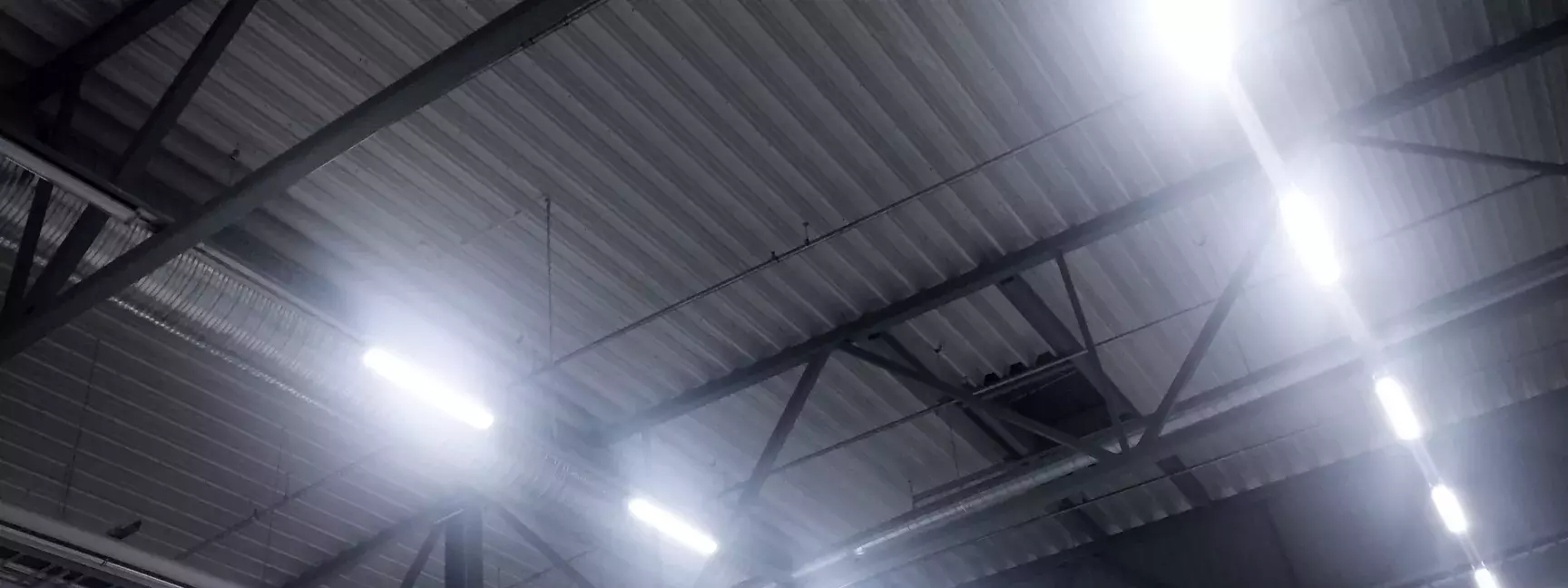 The ceiling of a building with LED lighting.